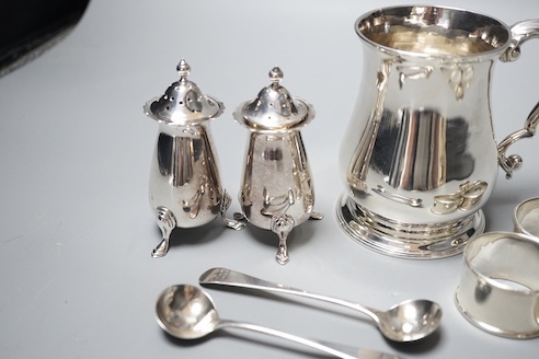 A George II silver baluster mug, John Payne, London, 1752, 97mm, together with five silver napkin rings, two silver condiment spoons and two silver pepperettes, 14oz.